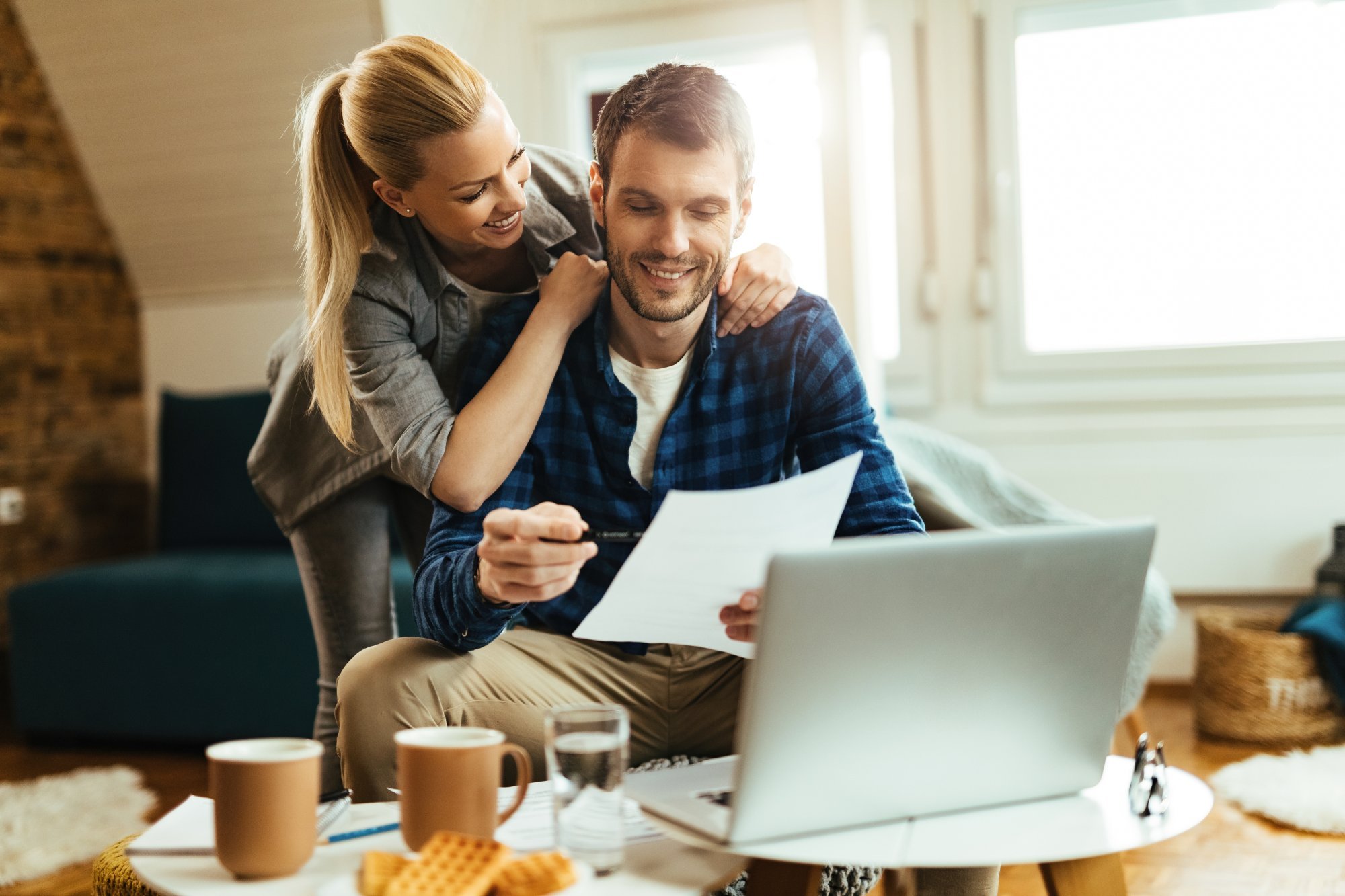 happy-couple-analyzing-their-home-budget-while-paying-bill-computer.jpg