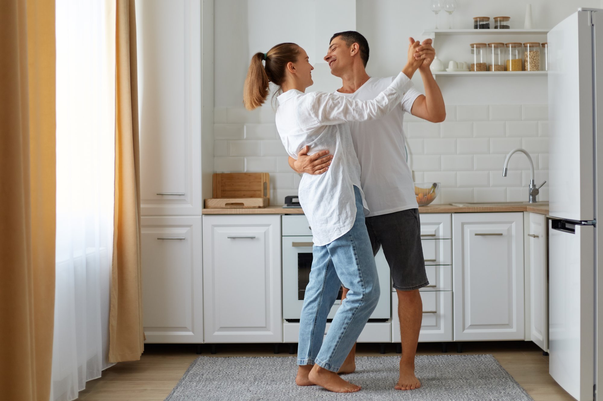 full-length-portrait-happy-smiling-husband-wife-dancing-together-home-light-room-with-kitchen-set-fridge-window-background-happy-couple.jpg