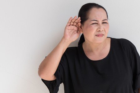 71049118-middle-age-woman-with-hearing-loss-hearing-impair-or-listening-receiving-bad-news.jpg
