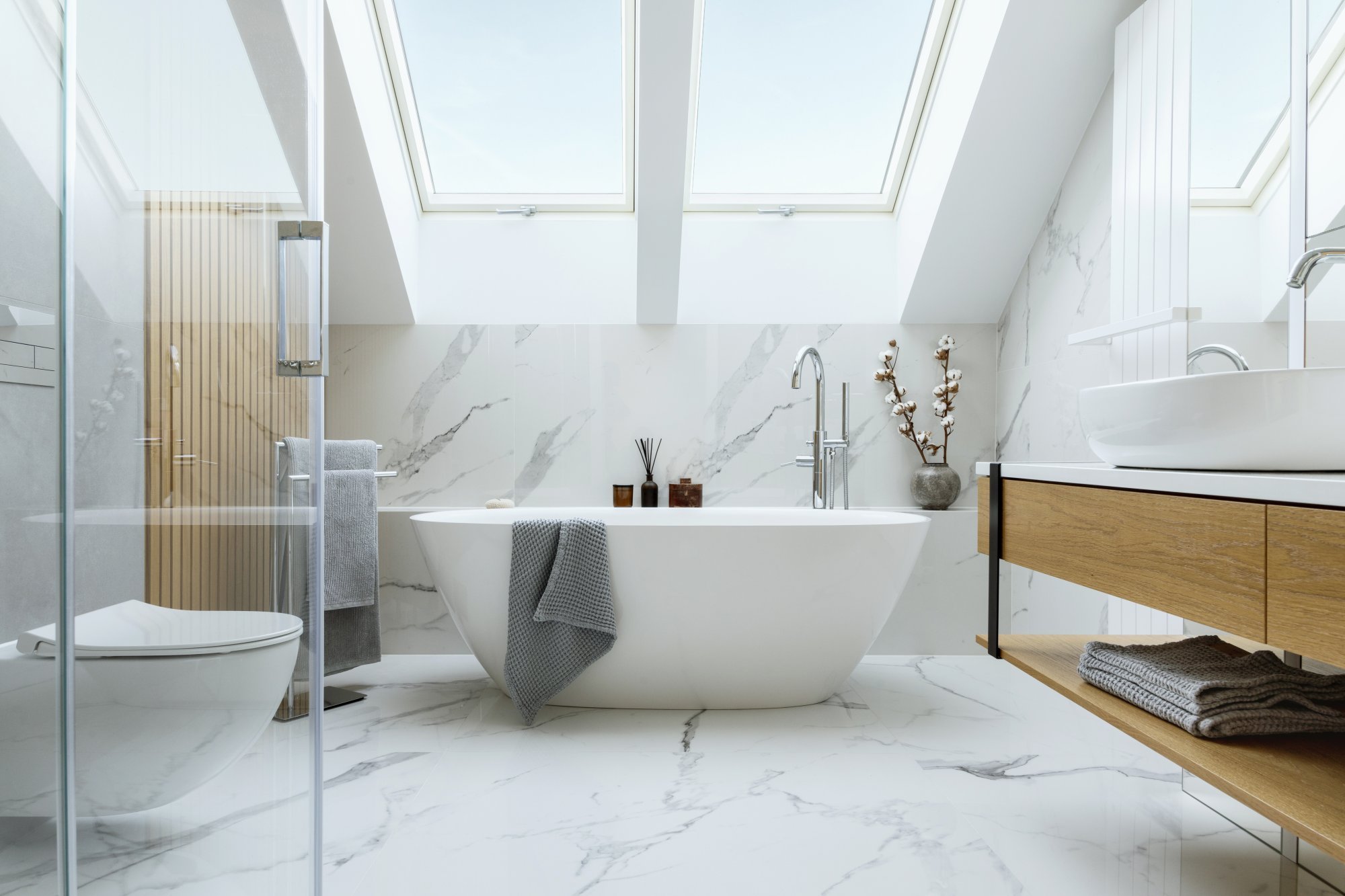 stylish-bathroom-interior-design-with-marble-panels-bathtub-towels-other-personal-bathroom-accessories-modern-glamour-interior-concept-roof-window-template.jpg