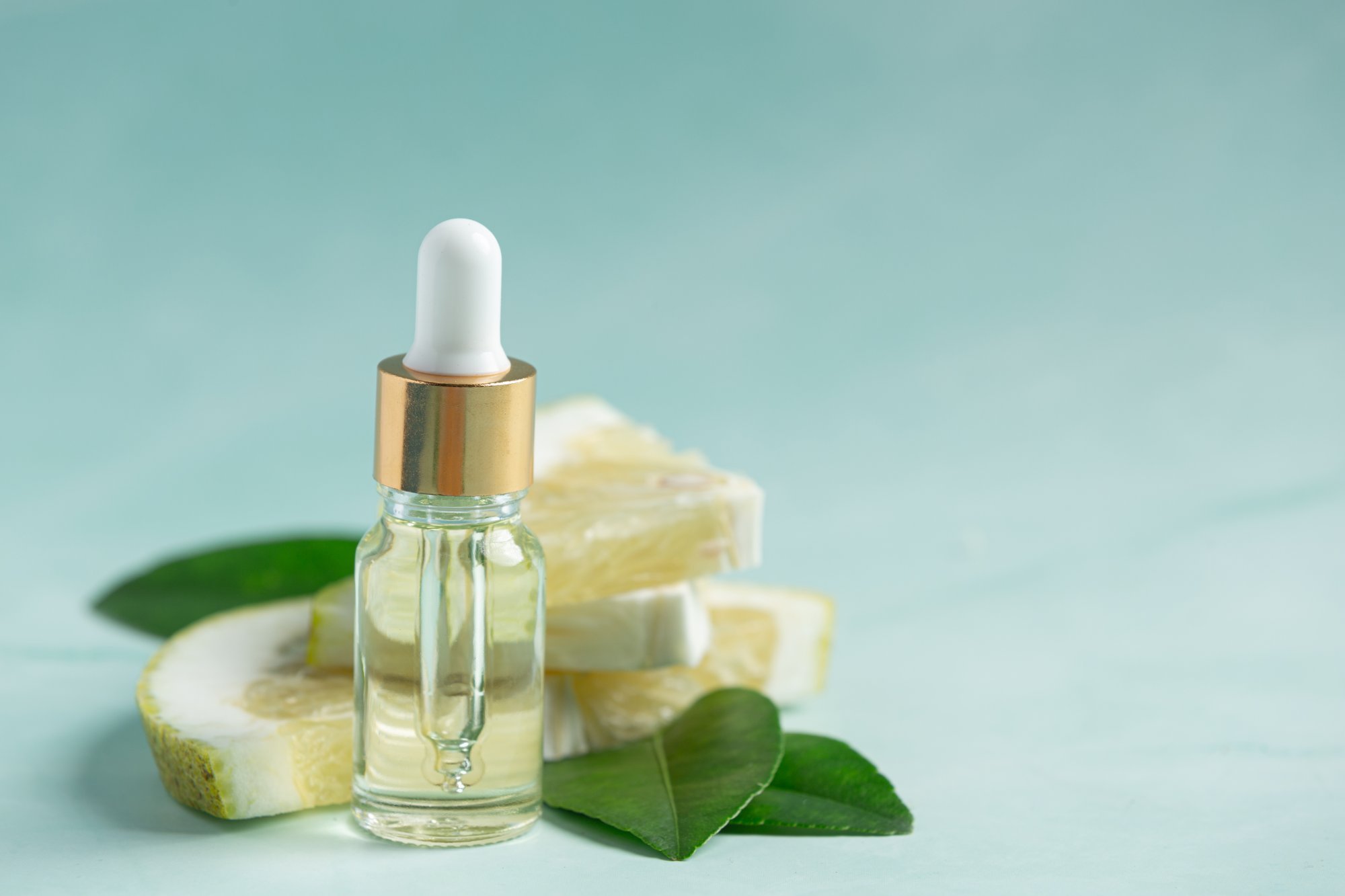 grapefruit-oil-serum-bottle-put-green-light-background.jpg